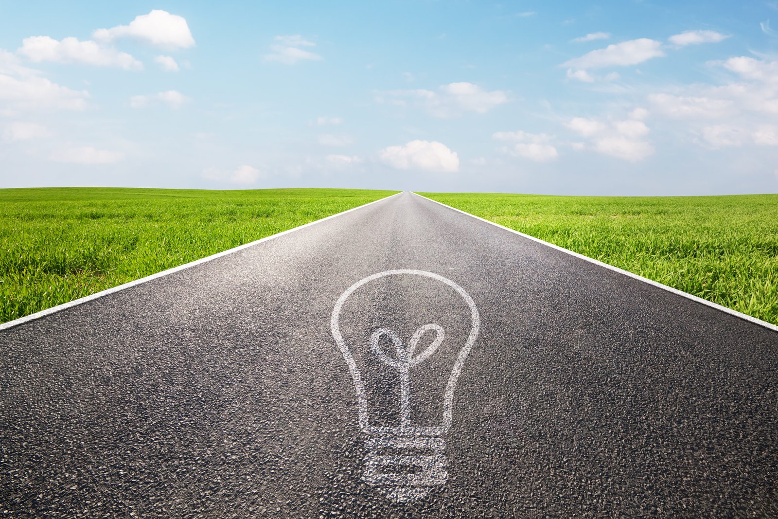 light bulb symbol on long empty straight road. environment, idea