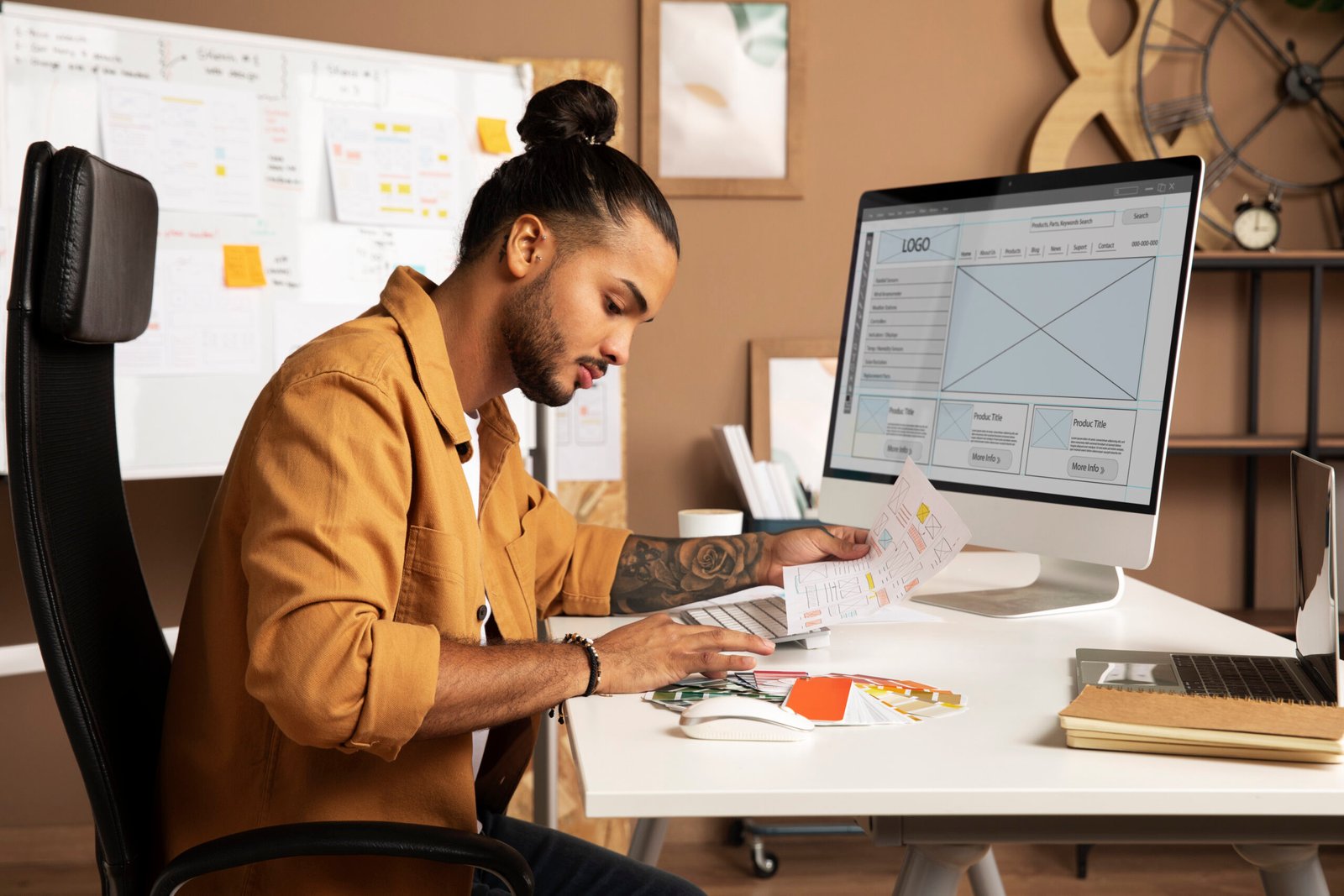 side view man working desk